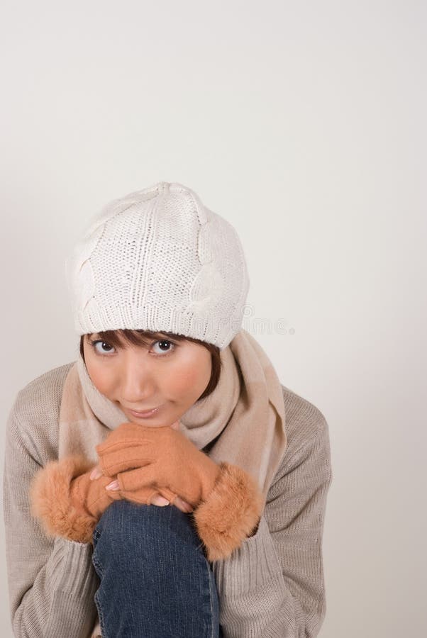 Woman wearing knit hat stock photo. Image of knee, people 7116756