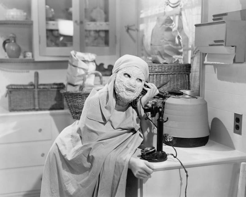 Woman wearing mask talking on phone royalty free stock photo Woman wearing mask talking on phone royalty free stock photo