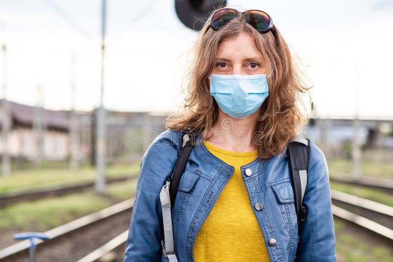 woman wearing mask in train station