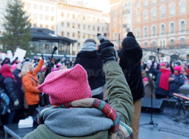 Woman wearing Pussyhat raising her fist in the Womens March, a w royalty free stock images Woman wearing Pussyhat raising her fist in the Womens March, a w royalty free stock images
