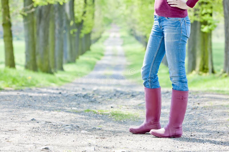 Woman wearing rubber boots stock photo. Image of fashion 23011498