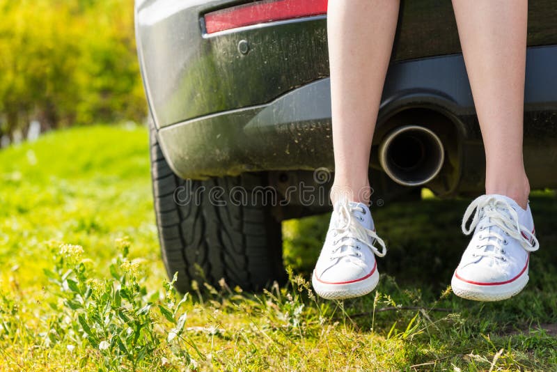 Woman Wearing Sneakers Sitting on Tailgate of Car Stock Image - Image ...