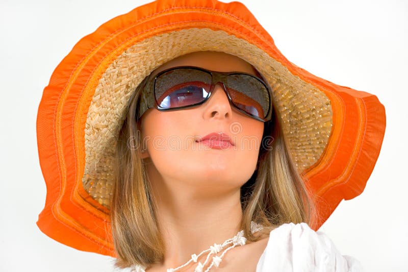 Woman wearing sun glasses and straw hat