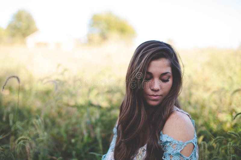 Woman Wearing Teal Off Shoulder While Seating On Grass Photo Free Public Domain Cc0 Image