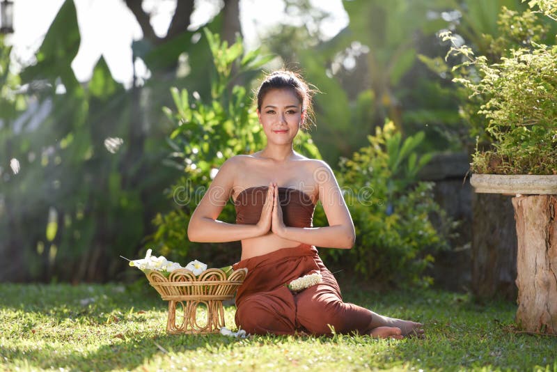 Woman wearing typical thai dress pay respect stock photo Woman wearing typical thai dress pay respect stock photo