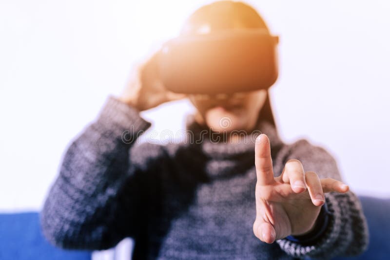 Woman wearing virtual reality glasses. Smartphone using with VR headset royalty free stock image Woman wearing virtual reality glasses. Smartphone using with VR headset royalty free stock image