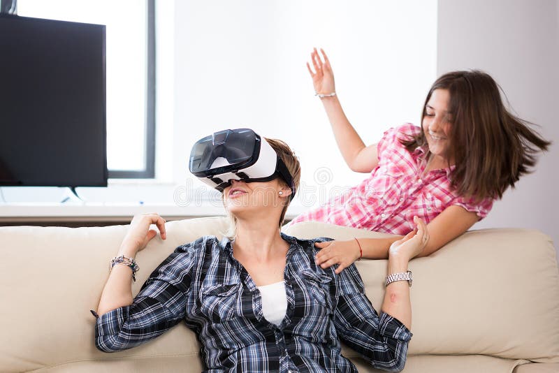 Woman Wearing A Virtual Reality VR Headset On Her Head Stock Image
