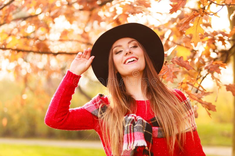Woman walking in park during autumn stock image Woman walking in park during autumn stock image