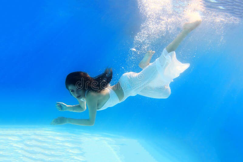 Photo Of Woman Swimming Underwater · Free Stock Photo