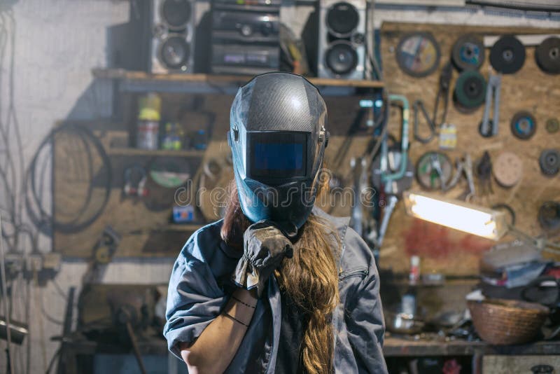 Woman with welding mask stock photo. Image of industrial 138293634
