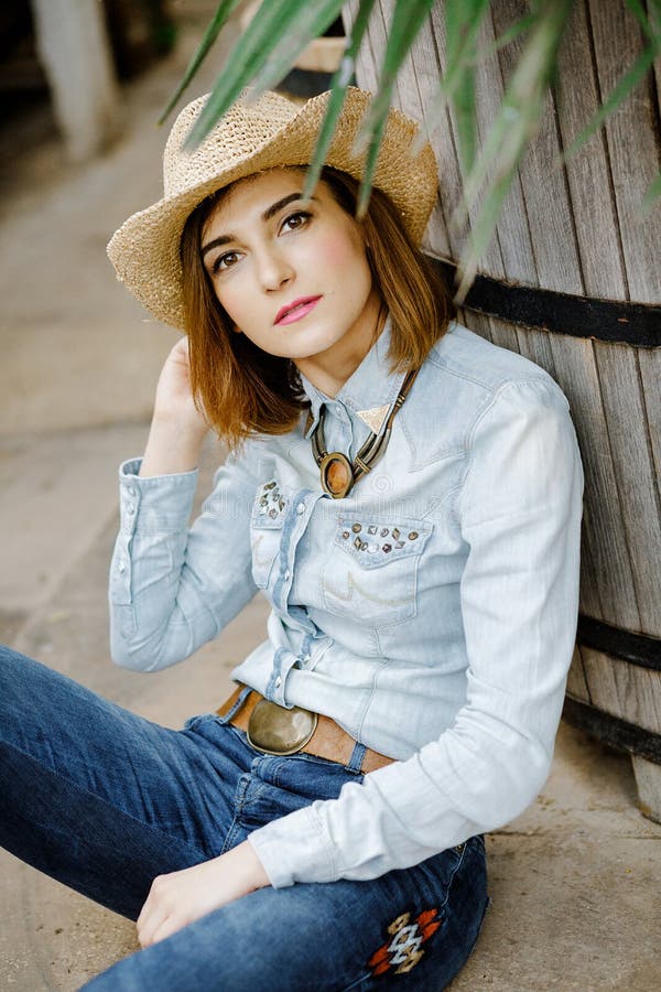 Woman in Western Wear in Cowboy Hat, Jeans and Cowboy Boots. Stock ...