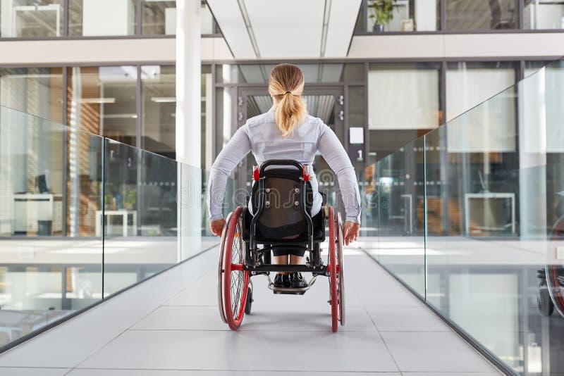 Woman in a wheelchair in the disabled office building