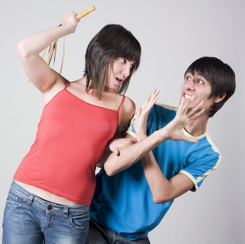 Aggressive woman with whip Stock Photo