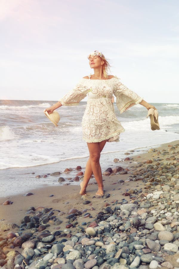 Woman in White Dress Walking Barefoot on the Beach Stock Image - Image ...