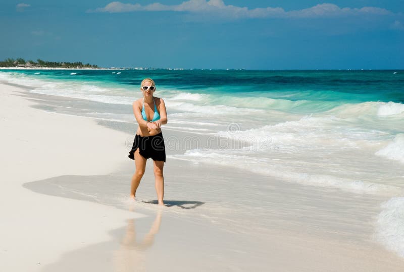 Woman on a White Sand Beach