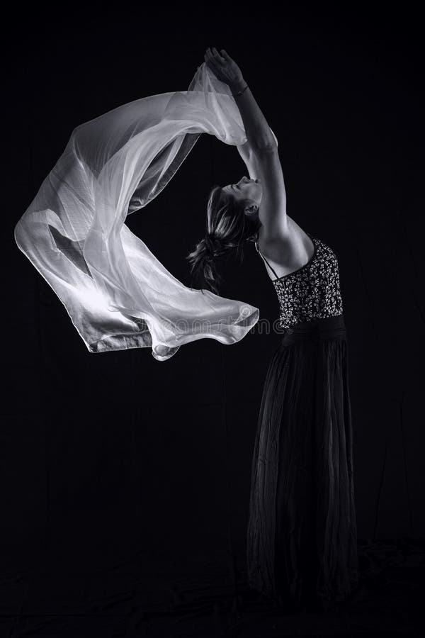 Woman with a white scarf on a black background. royalty free stock photo Woman with a white scarf on a black background. royalty free stock photo