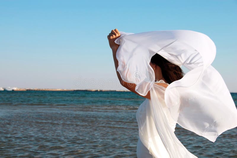 Woman in white at seaside