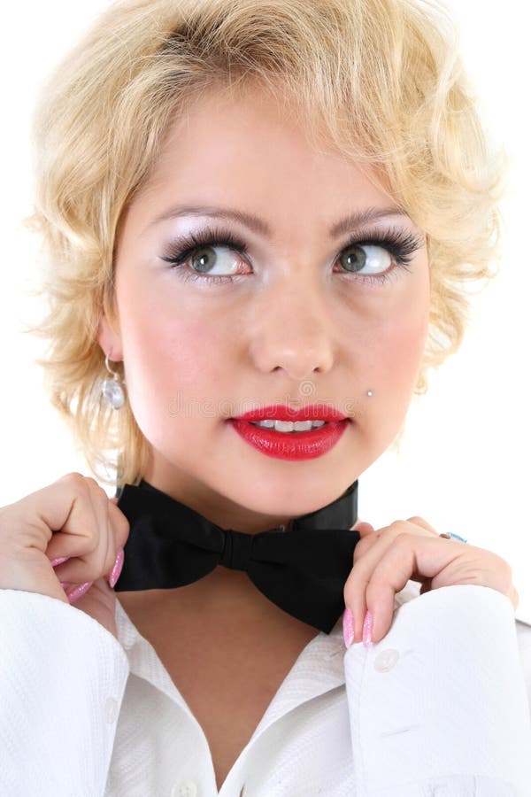 Woman in white shirt correcting a bow-tie