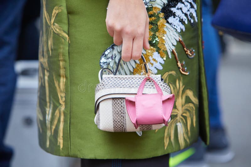 MILAN, ITALY - SEPTEMBER 20, 2018: Woman with Louis Vuitton small bag and  white dress with denim torn cuffs before Fendi fashion show, Milan Fashion  W Stock Photo - Alamy