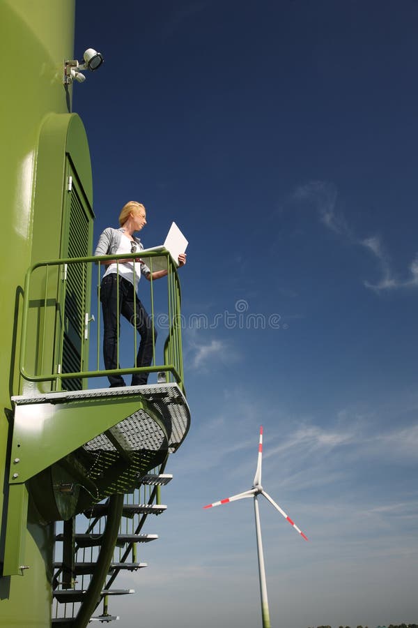 Woman and wind turbine