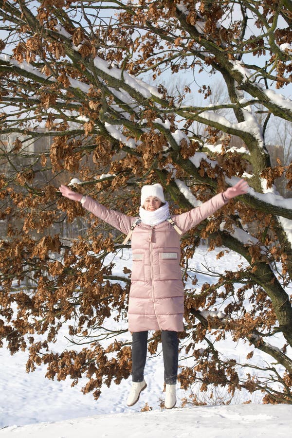 Woman in Winter Clothes on a Walk in the Park. There is a Lot of Snow  Around Stock Photo - Image of walk, forest: 207578936