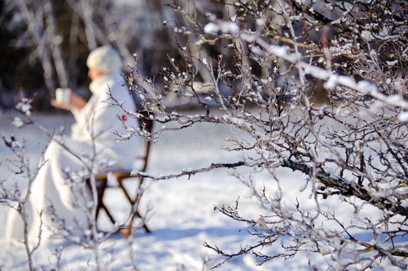 Woman in winter forest