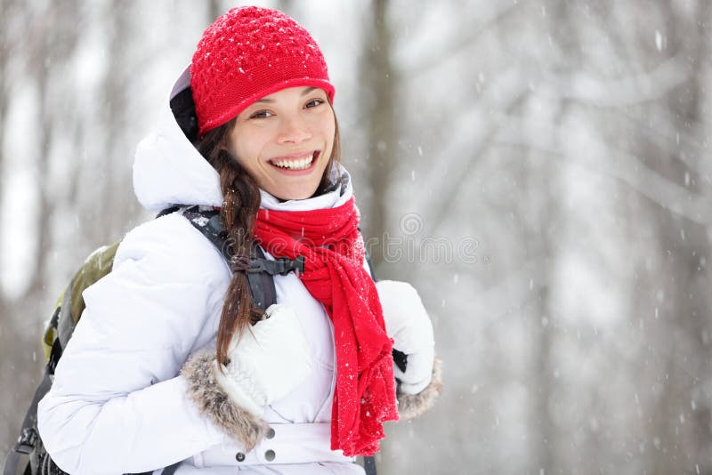 Woman winter hiking in snow royalty free stock image