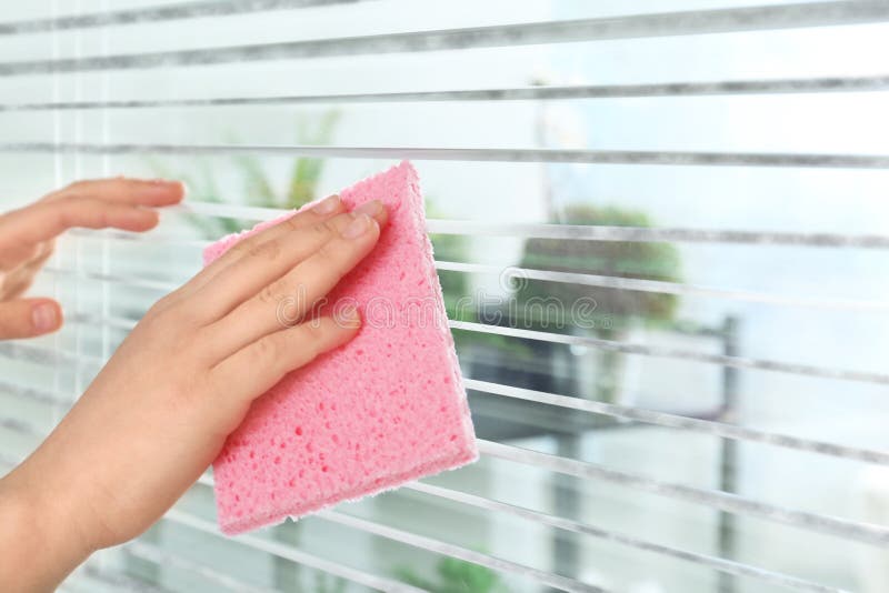Woman wiping window blinds with rag indoors. Before and after cleaning royalty free stock photos Woman wiping window blinds with rag indoors. Before and after cleaning royalty free stock photos