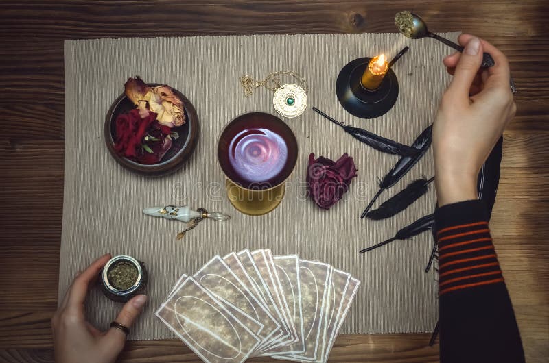 Woman witch prepare a magic potion. Tarot cards. Future reading. Fortune teller concept.