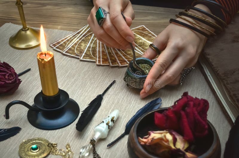 Woman witch prepare a magic potion. Tarot cards. Future reading. Fortune teller concept.