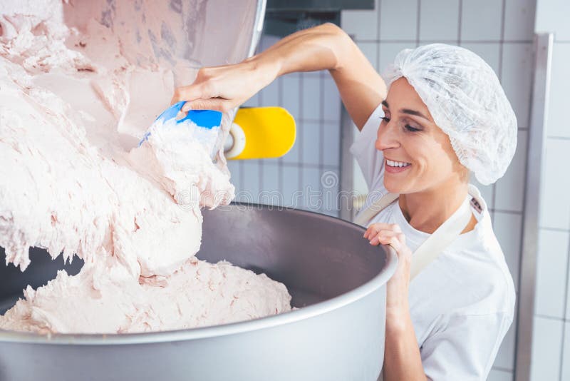 Woman working in butchery making minced meat royalty free stock image Woman working in butchery making minced meat royalty free stock image
