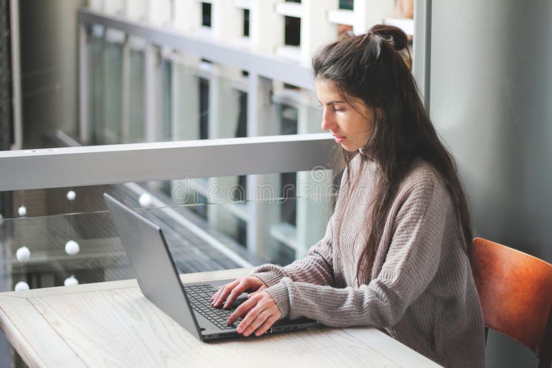 Woman working at cafe hands on keyboard laptop. royalty free stock photography Woman working at cafe hands on keyboard laptop. royalty free stock photography