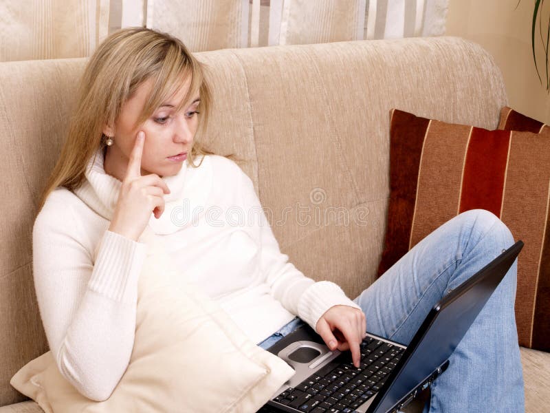 Woman working on her laptop.