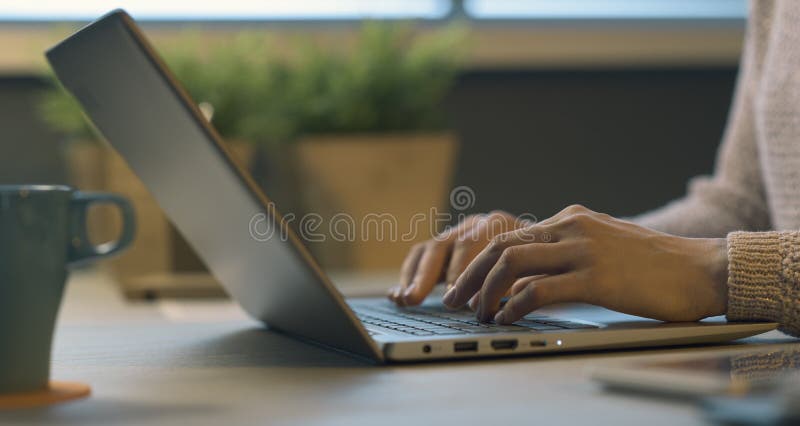 Woman working with her laptop stock photography