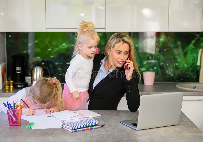 Woman working from home and being with children