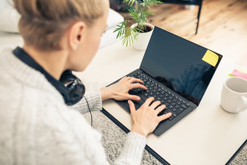 Woman working from home on laptop computer