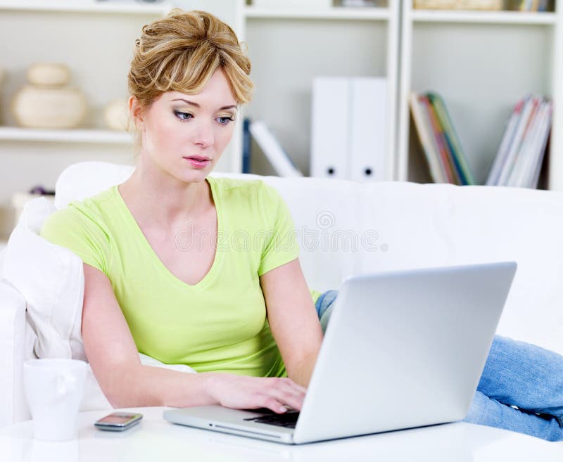 Young Woman Working with a Laptop in a Cafe Stock Image - Image of ...