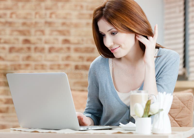 Woman is working on the laptop stock photo Woman is working on the laptop stock photo