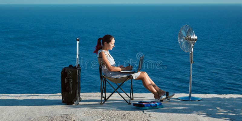 Woman working with laptop on beach. Business travelling and remote work concept. Life work balance, freelance idea