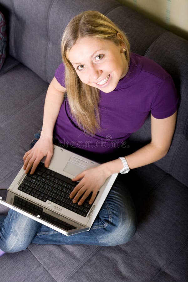 Woman working on laptop at home