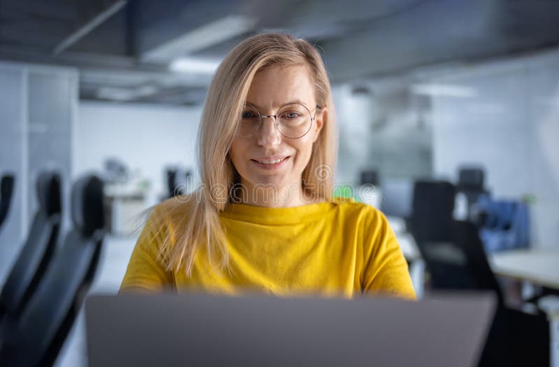 Woman Working on Laptop at Office Stock Photo - Image of sitting ...