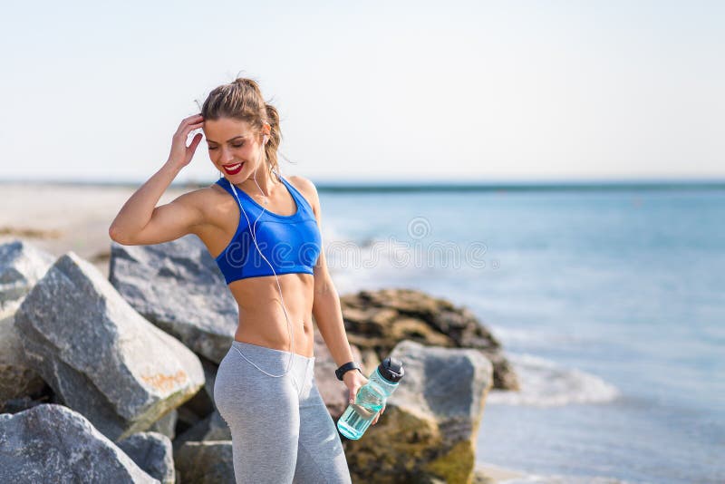 Woman working out at the beach