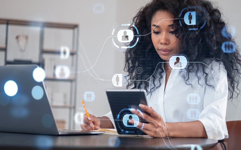 Woman working on tablet with digital network icons, sitting at d stock photos