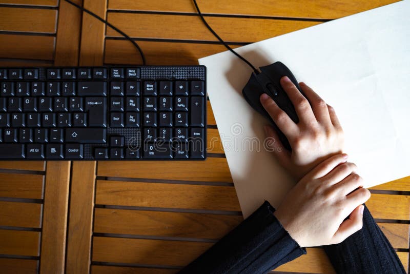 Woman with Wrist Pain from Working with the Mouse Stock Photo Image