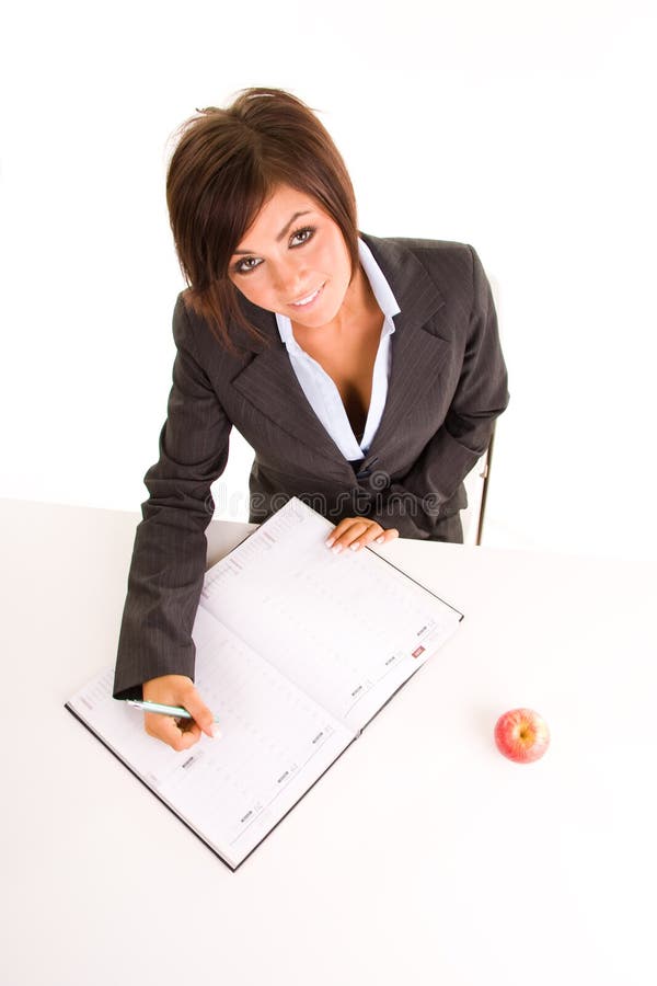 Woman writing in calendar