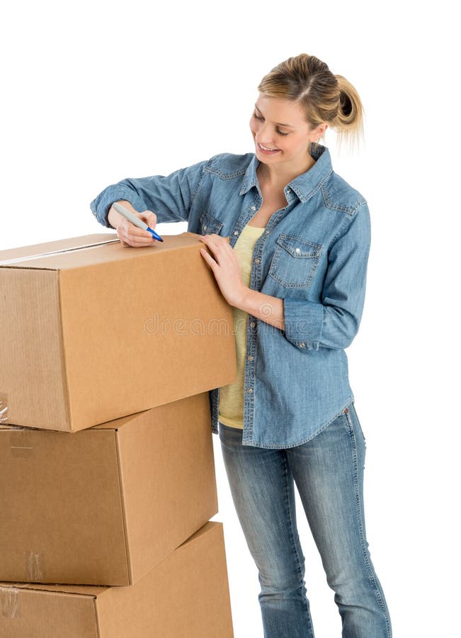 Woman Writing On Cardboard Boxes stock photography