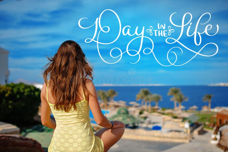 Woman in yellow sundress looks at the sea and text Day in the life. Calligraphy lettering vintage hand draw stock images Woman in yellow sundress looks at the sea and text Day in the life. Calligraphy lettering vintage hand draw stock images