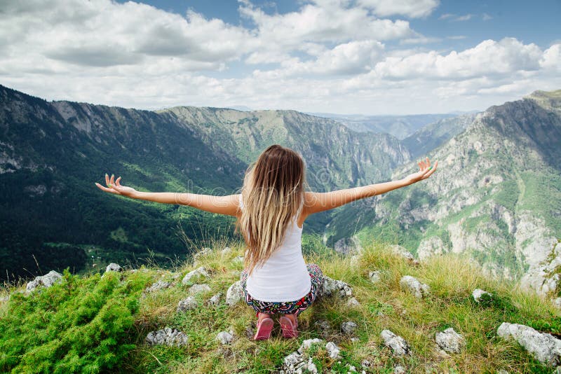 Woman yoga relax at the end of earth in fascinating landscape