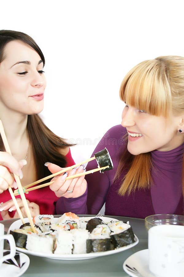 Womans eating sushi