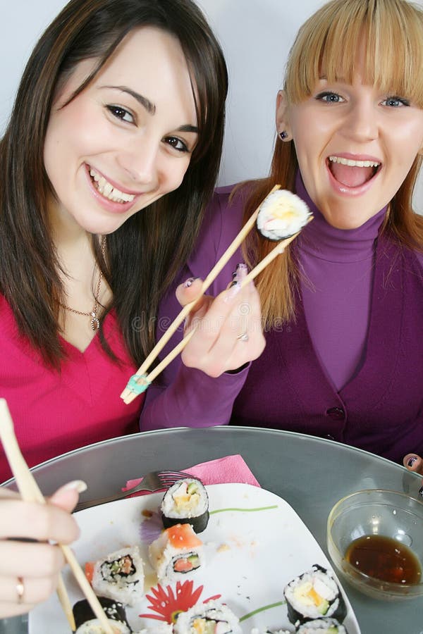 Womans eating sushi